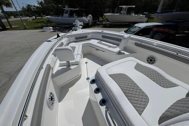 Slide: The Image of 2026 Caymas 291 boat interior with cushioned seating and modern design. - 19
