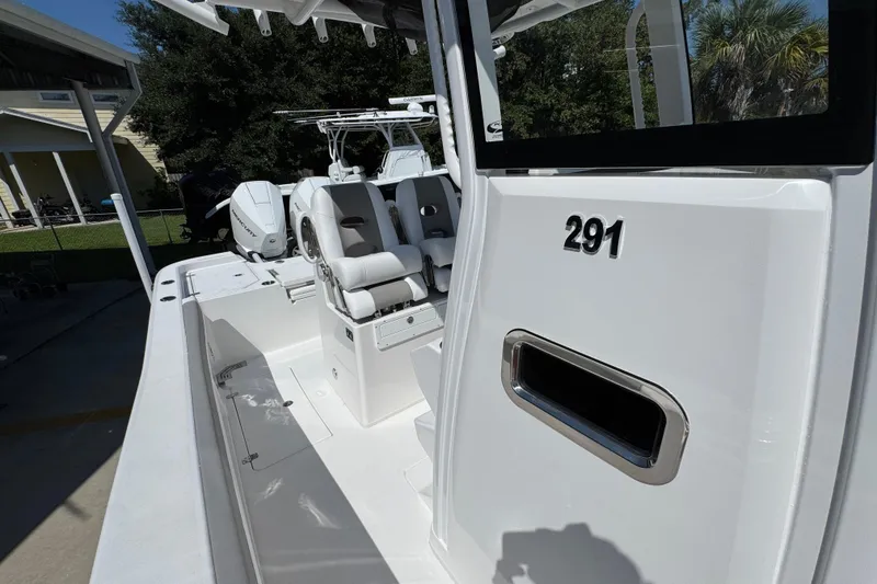Slide: The Image of 2026 Caymas 291 boat interior with seating and modern design features. - 25