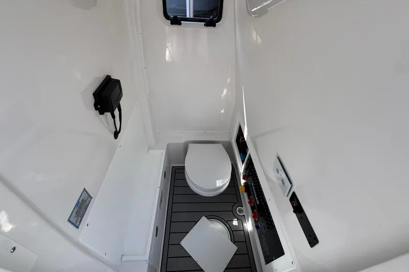 Slide: The Image of 2026 Caymas 291 boat interior with compact bathroom and modern fixtures. - 26