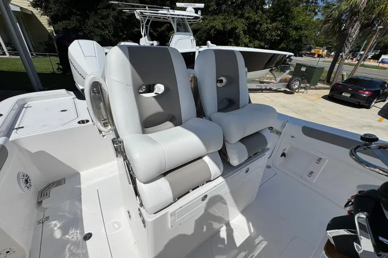 Slide: The Image of 2026 Caymas 291 boat interior with dual cushioned seats and modern design. - 33