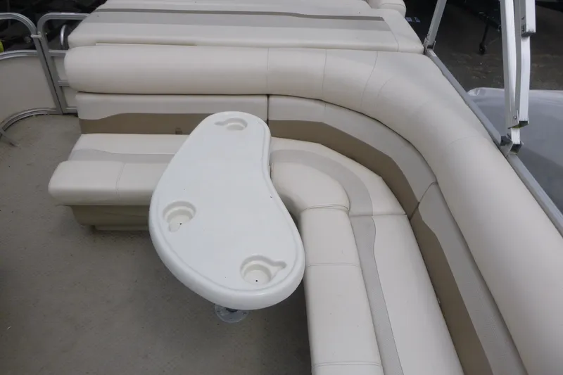 Slide: The Image of 2007 SunChaser 8520 Cruise boat interior with beige seating and a white table. - 11