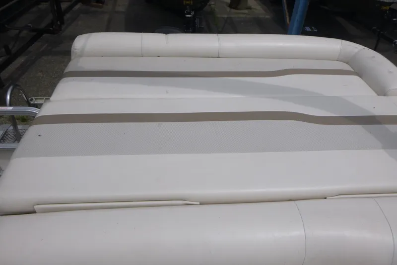 Slide: The Image of SunChaser 8520 Cruise 2007 boat seat with beige and white upholstery. - 12