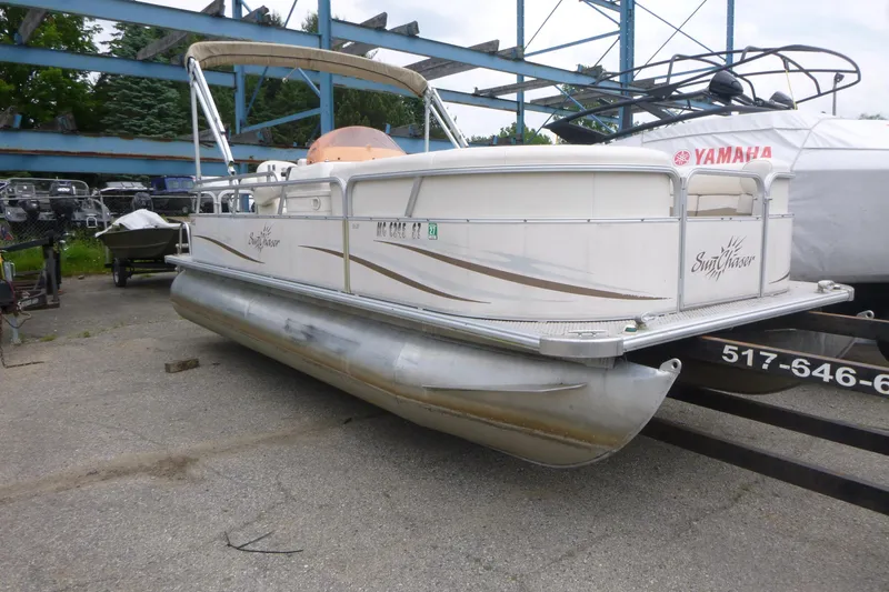 Slide: The Image of 2007 SunChaser 8520 Cruise pontoon boat on trailer in storage yard. - 3