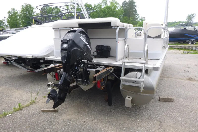 Slide: The Image of 2007 SunChaser 8520 Cruise pontoon boat with Mercury outboard motor, parked on a trailer. - 4