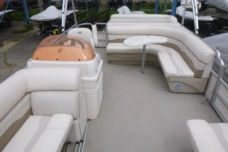 Slide: The Image of 2007 SunChaser 8520 Cruise pontoon boat with beige seating and a small table. - 5