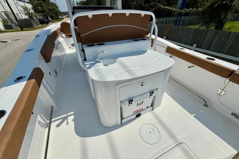 Slide: The Image of 2026 Sea Hunt Ultra 305 SE boat interior with seating and storage. - 8