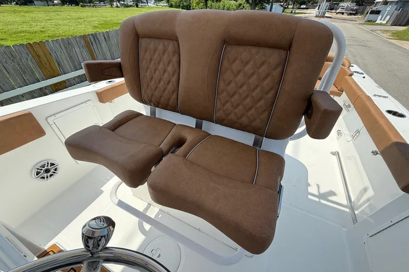 Slide: The Image of Luxurious brown seating on 2026 Sea Hunt Ultra 305 SE boat, featuring diamond stitching. - 9