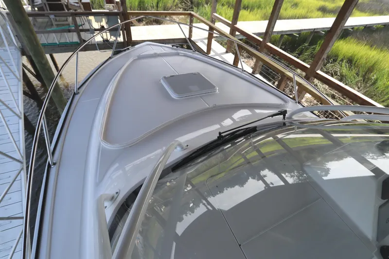 Slide: The Image of 2024 Albemarle 30 Express boat with Garmin and FLIR equipment under a wooden shelter. - 16