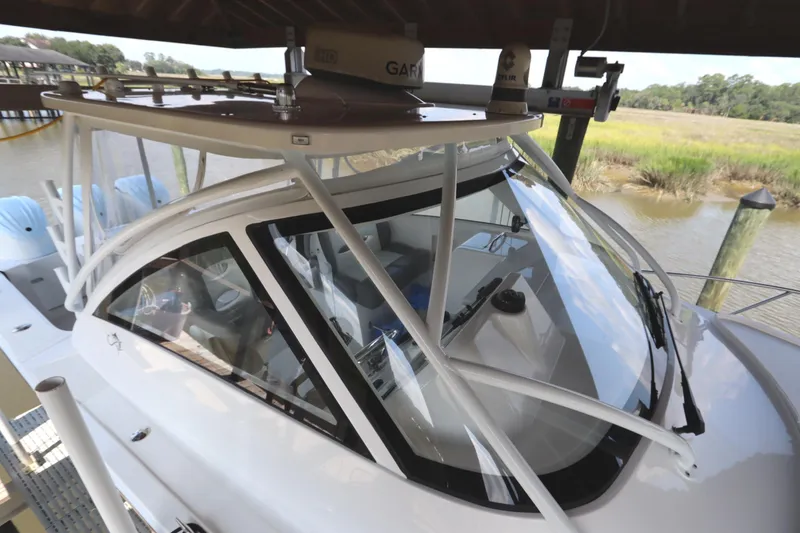 Slide: The Image of 2024 Albemarle 30 Express boat docked, showcasing sleek design and spacious deck. - 17