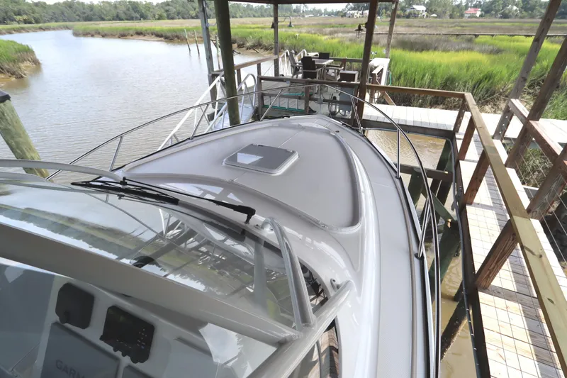 Slide: The Image of 2024 Albemarle 30 Express boat docked, showcasing sleek design and advanced navigation equipment. - 18