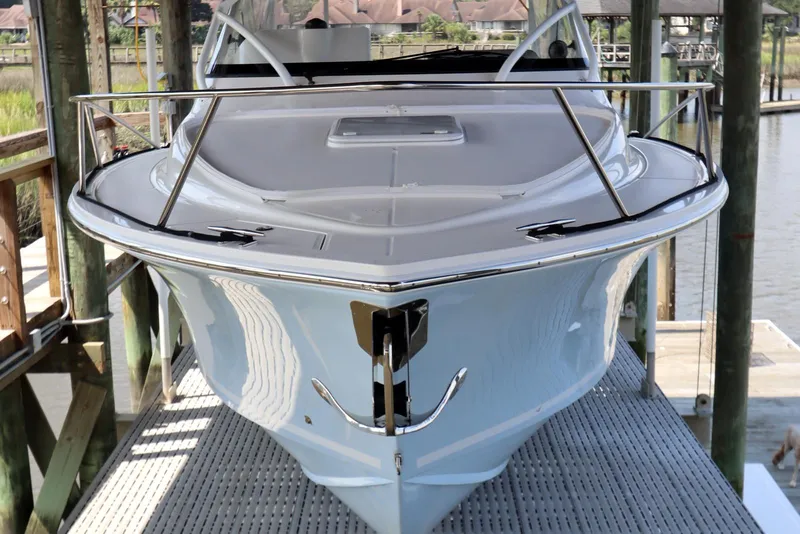 Slide: The Image of 2024 Albemarle 30 Express boat docked, showcasing sleek design and modern features. - 2