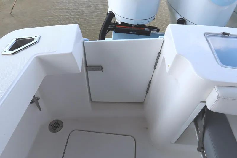 Slide: The Image of 2024 Albemarle 30 Express boat deck with triple outboard engines and seating. - 24