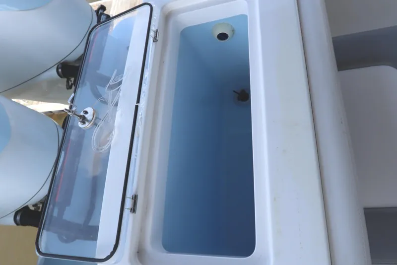 Slide: The Image of Triple Yamaha outboard engines on 2024 Albemarle 30 Express boat, docked in a serene waterway. - 27