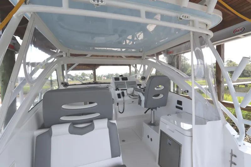 Slide: The Image of 2024 Albemarle 30 Express boat storage compartment with open lid. - 31