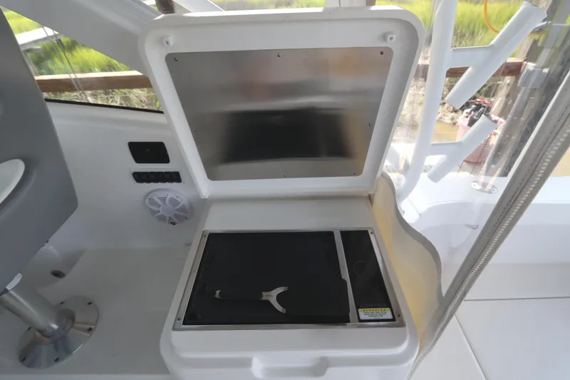 Slide: The Image of 2024 Albemarle 30 Express boat interior with seating and storage compartment. - 40