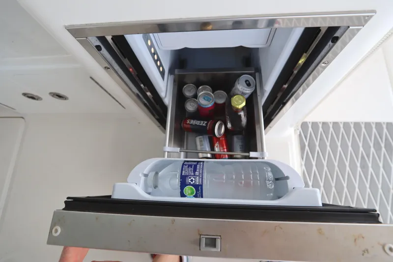 Slide: The Image of 2024 Albemarle 30 Express boat interior with storage compartment and seating. - 41