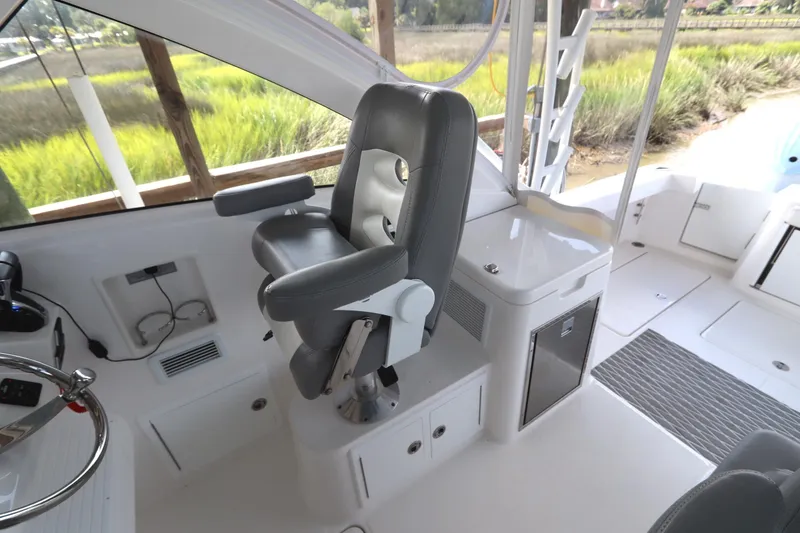 Slide: The Image of Helm of 2024 Albemarle 30 Express with Garmin navigation system and controls. - 45