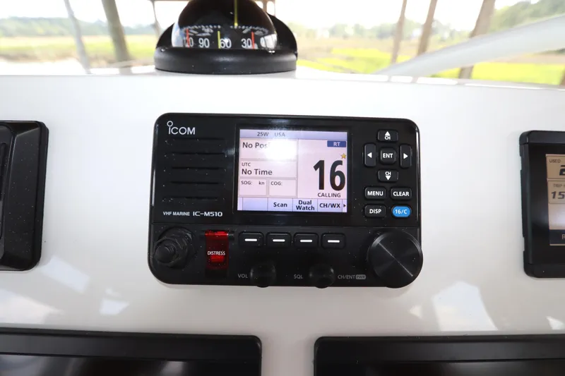 Slide: The Image of 2024 Albemarle 30 Express boat dashboard with Bluetooth stereo display. - 56