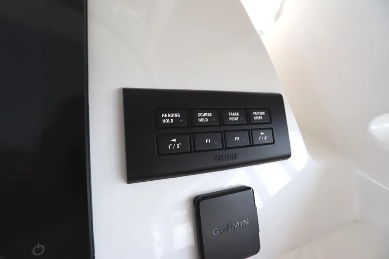 Slide: The Image of Control panel of 2024 Albemarle 30 Express boat with labeled switches. - 58