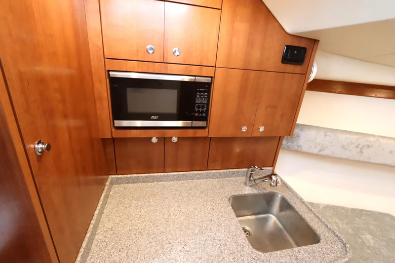 Slide: The Image of 2024 Albemarle 30 Express boat interior with gray and white seating, sleek design. - 62