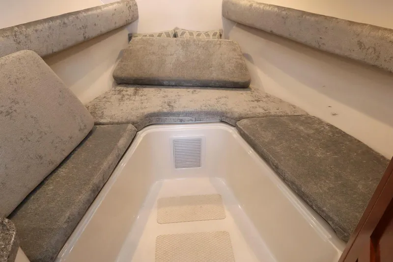 Slide: The Image of 2024 Albemarle 30 Express cabin interior with bed, sink, and cushions. - 73