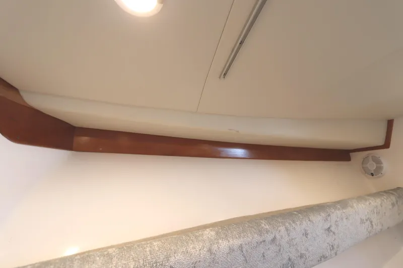 Slide: The Image of 2024 Albemarle 30 Express cabin interior with cushioned seating and neutral tones. - 74