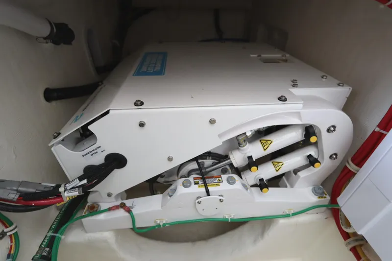 Slide: The Image of 2024 Albemarle 30 Express engine compartment with Dolphin Pro 12.30 charger and wiring. - 77