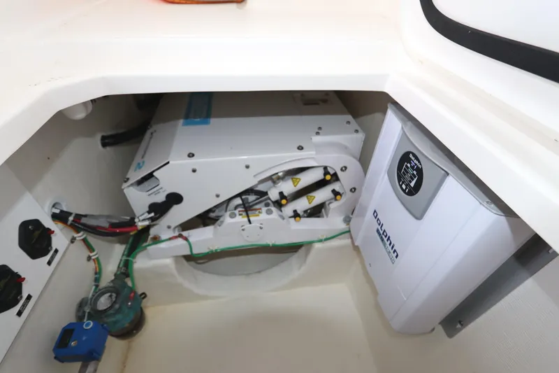 Slide: The Image of Engine compartment of 2024 Albemarle 30 Express, featuring Yanmar IS 4.04 generator system. - 79