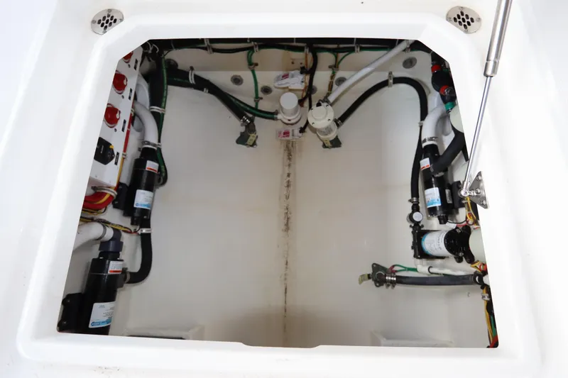 Slide: The Image of 2024 Albemarle 30 Express engine compartment with wiring and control panel. - 82