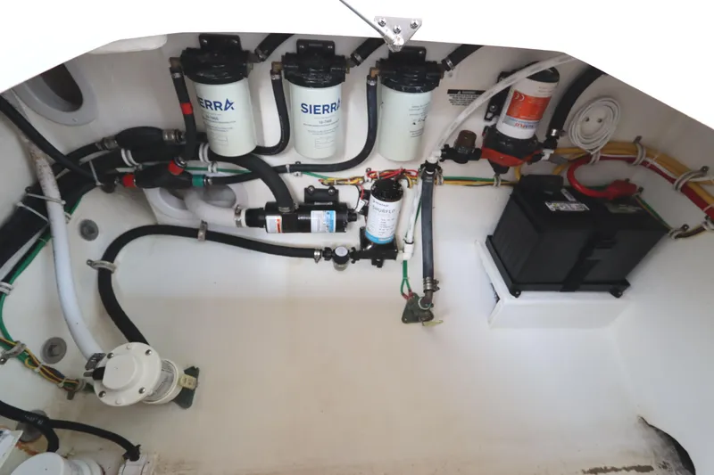 Slide: The Image of 2024 Albemarle 30 Express engine compartment with wiring and plumbing systems. - 84