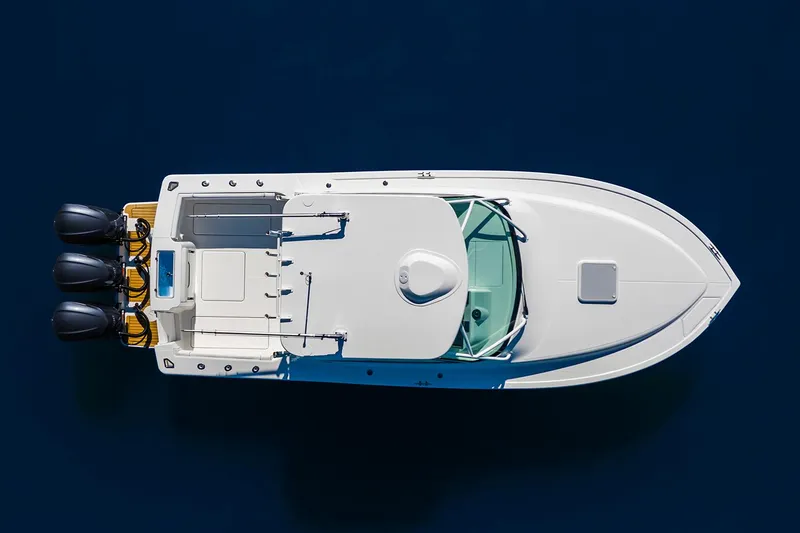 Slide: The Image of Manufacturer Provided Image: 2024 Albemarle 30 Express boat, aerial view, white hull, triple outboard engines. - 87