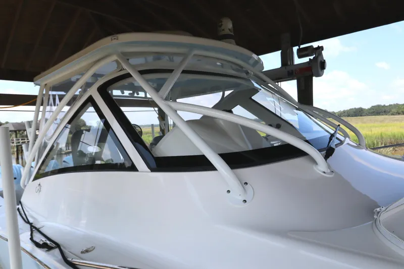 Slide: The Image of 2024 Albemarle 30 Express boat with triple outboard engines on a lift. - 9