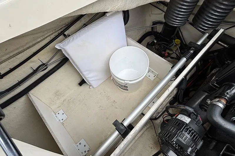Slide: The Image of Engine compartment of 2008 Sea Ray 185 Sport with bucket and pillow. - 10
