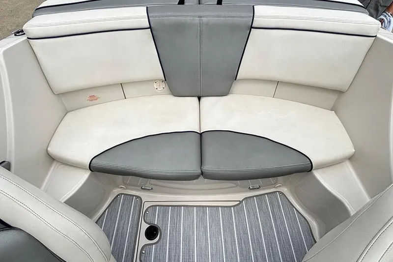 Slide: The Image of 2008 Sea Ray 185 Sport boat interior with gray and white seating. - 13