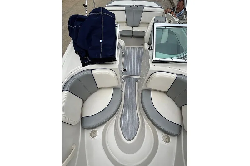Slide: The Image of 2008 Sea Ray 185 Sport boat interior with gray and white seating, windshield, and deck. - 17