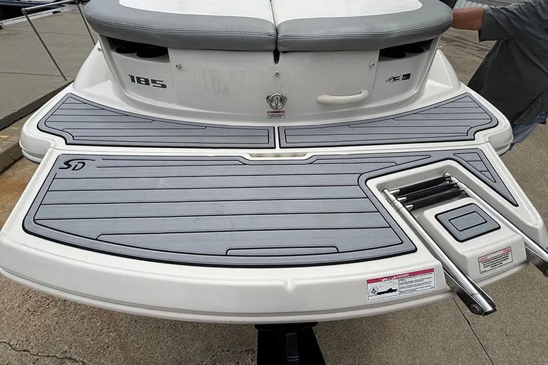 Slide: The Image of 2008 Sea Ray 185 Sport boat with gray swim platform and ladder. - 7