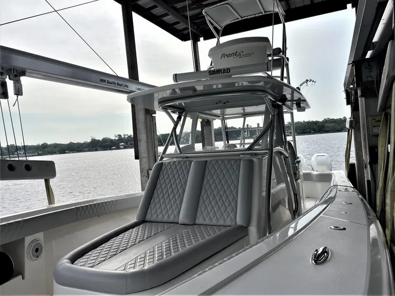 Slide: The Image of 2020 Front Runner 39 Center Console boat docked by the water. - 13