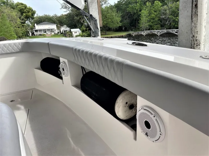 Slide: The Image of 2020 Front Runner 39 Center Console boat interior with speakers and storage compartments. - 18