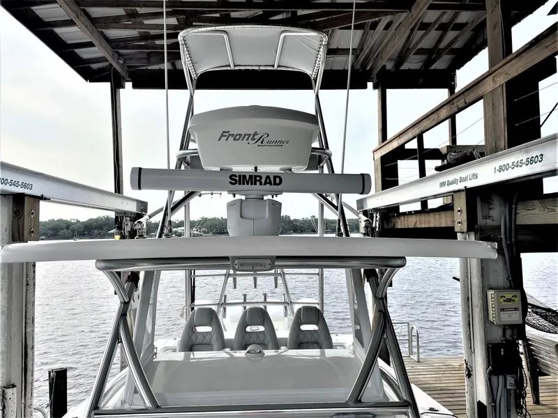 Slide: The Image of 2020 Front Runner 39 Center Console boat docked, featuring Simrad electronics. - 20