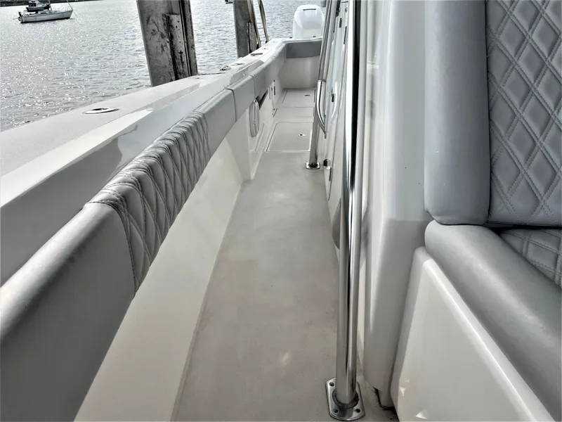 Slide: The Image of 2020 Front Runner 39 Center Console boat interior with cushioned seating and sleek design. - 21