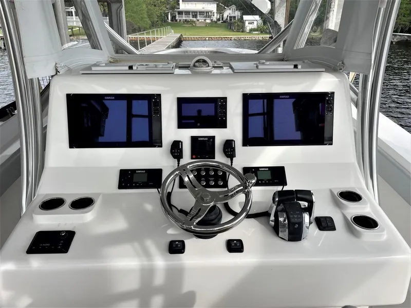 Slide: The Image of 2020 Front Runner 39 Center Console helm with advanced navigation displays and controls. - 29