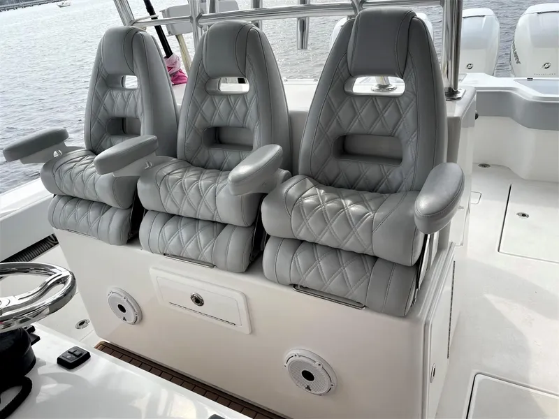 Slide: The Image of 2020 Front Runner 39 Center Console with luxurious gray seating on a boat. - 35