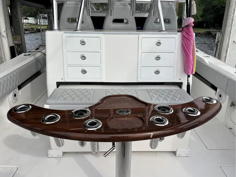 Slide: The Image of 2020 Front Runner 39 Center Console boat interior with rod holders and storage drawers. - 37