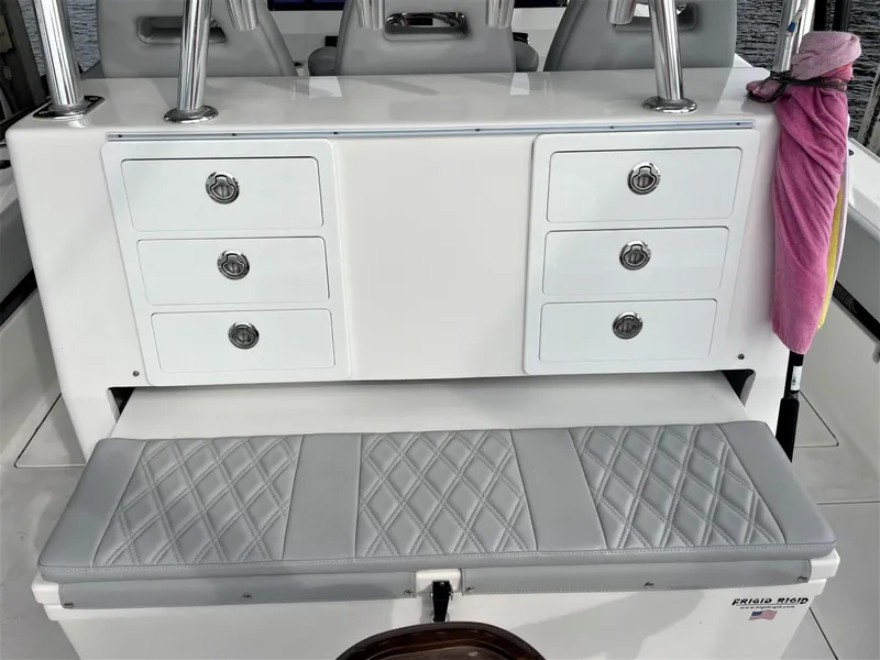 Slide: The Image of 2020 Front Runner 39 Center Console with cushioned seating and storage drawers. - 38