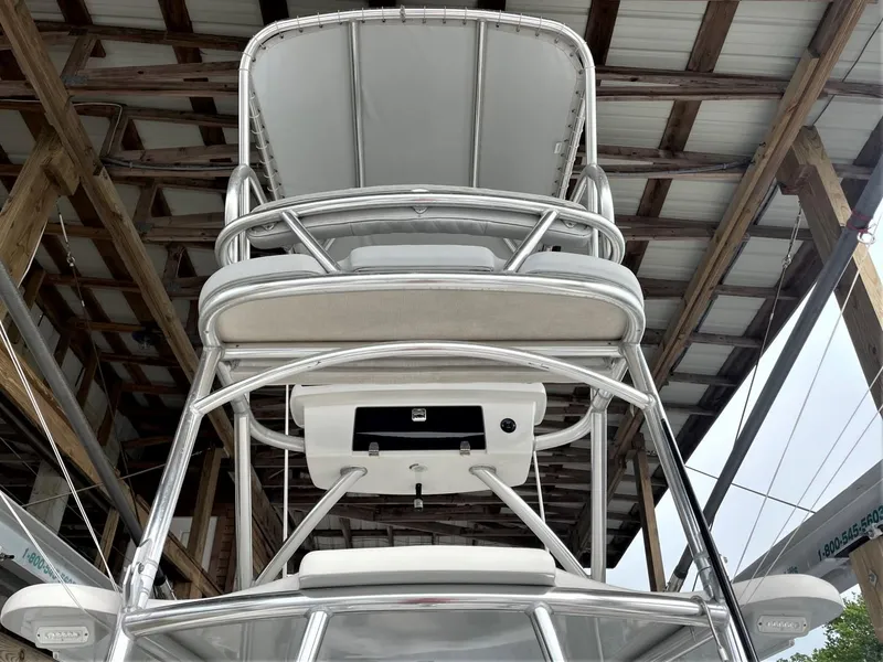Slide: The Image of 2020 Front Runner 39 Center Console boat tower under a wooden roof structure. - 40