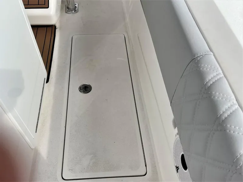 Slide: The Image of 2020 Front Runner 39 Center Console boat deck with storage compartment and cushioned seating. - 47