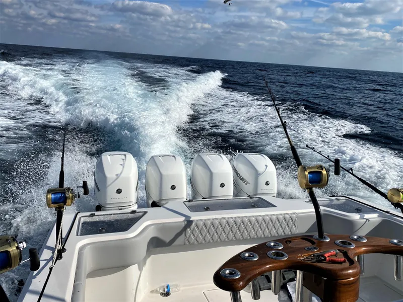 Slide: The Image of 2020 Front Runner 39 Center Console boat cruising with fishing rods and ocean view. - 6