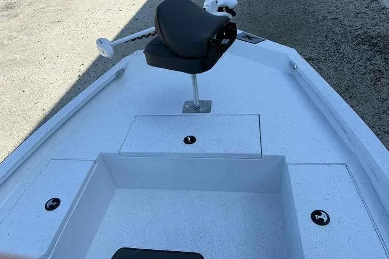 Slide: The Image of 2026 Xpress H20B boat deck with seating and storage compartments. - 11