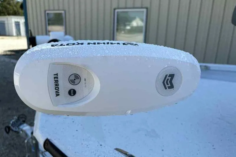 Slide: The Image of Minn Kota Terrova motor on 2026 Xpress H20B boat, covered in water droplets. - 12