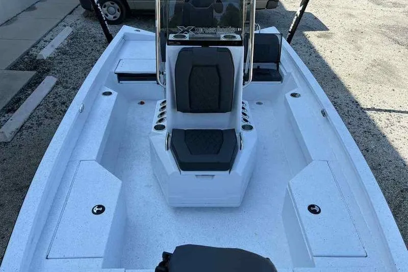 Slide: The Image of 2026 Xpress H20B boat interior with seating and storage compartments. - 14